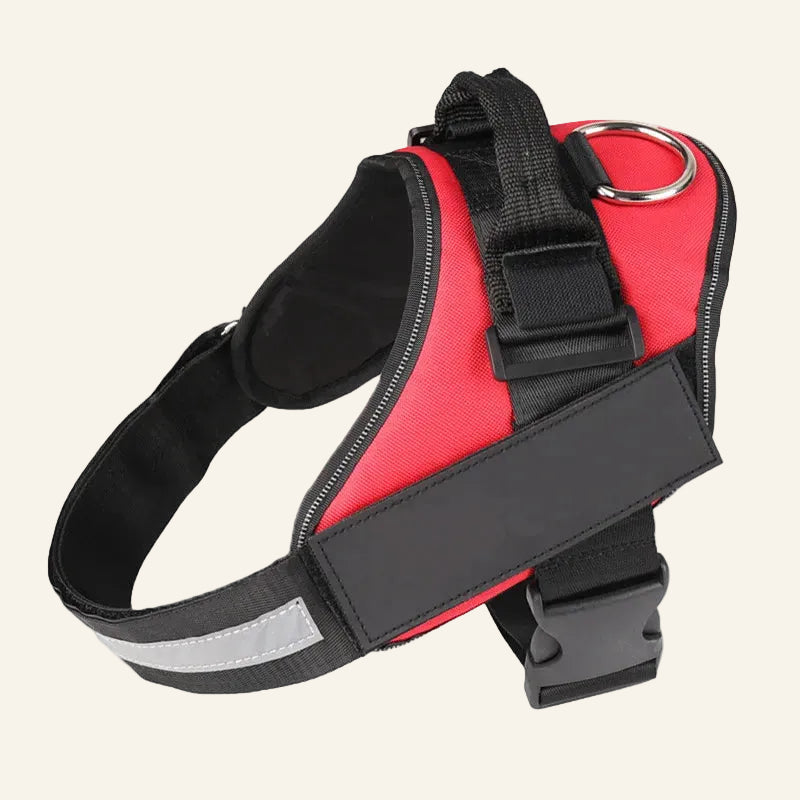 Red and black dog harness with reflective strip on a white background
