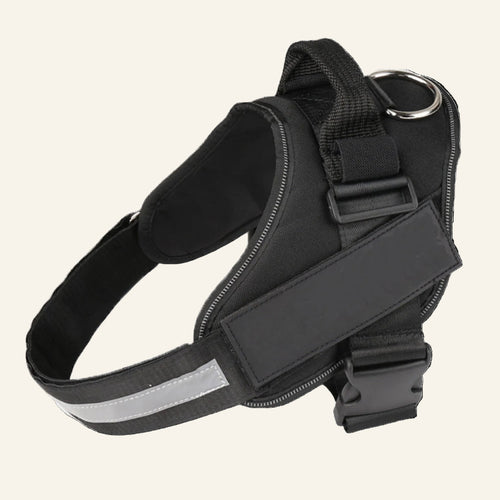 Black dog harness with reflective strip on a white background